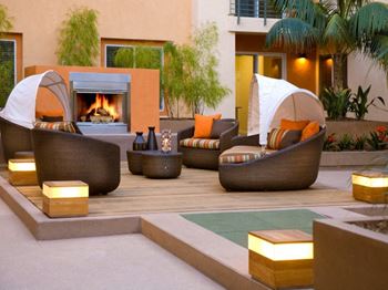Two outdoor fireplace lounges